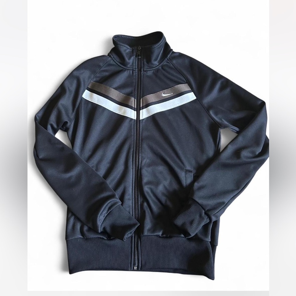 Nike track jacket.Black with white and taupe/grey stripes. Women’s size Medium.